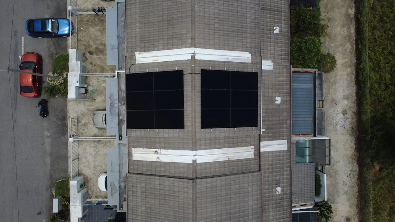 Aerial view of installed solar panels on Malaysian roof